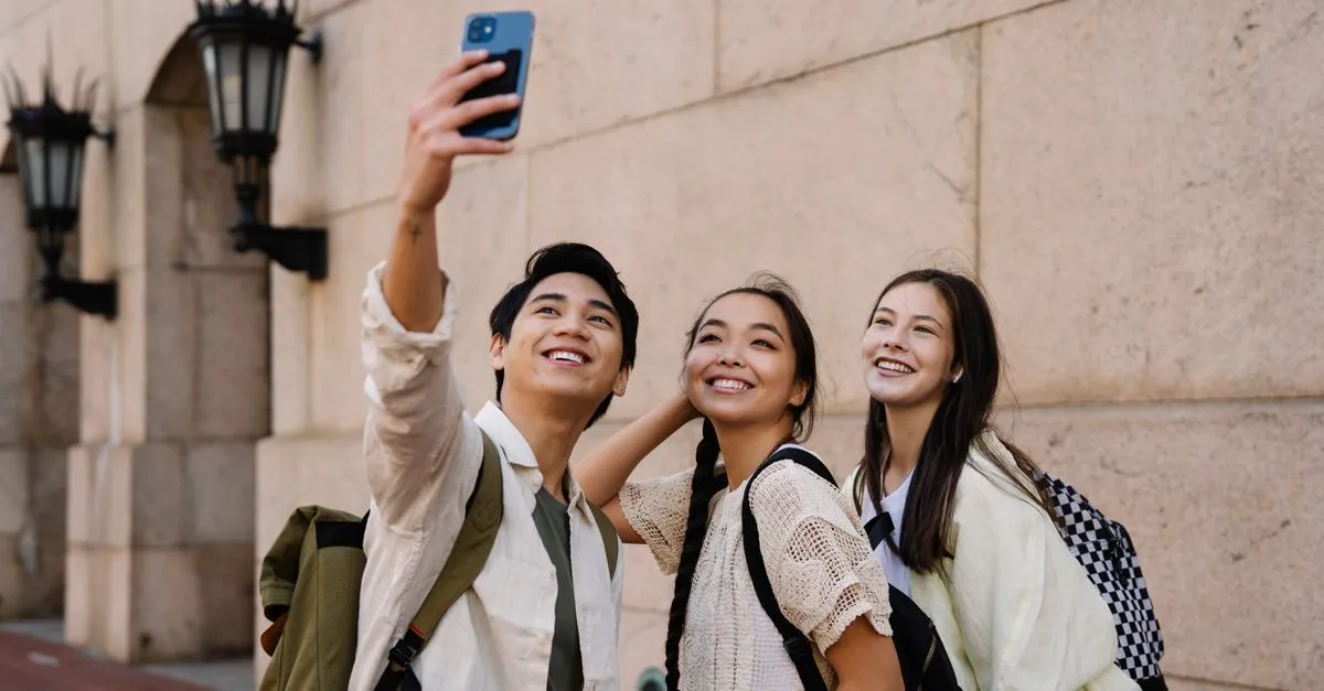 Group of friends checking a phone together